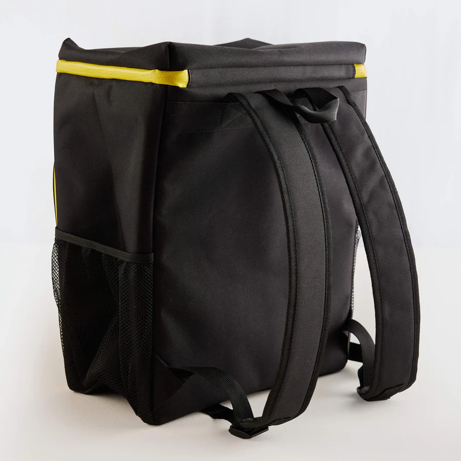 The Guinness x Fatti Burke Sun Cooler Bag by Guinness Webstore UK is a black insulated backpack with yellow trim, mesh side pocket, and two padded shoulder straps—ideal for keeping drinks cool on any island adventure.